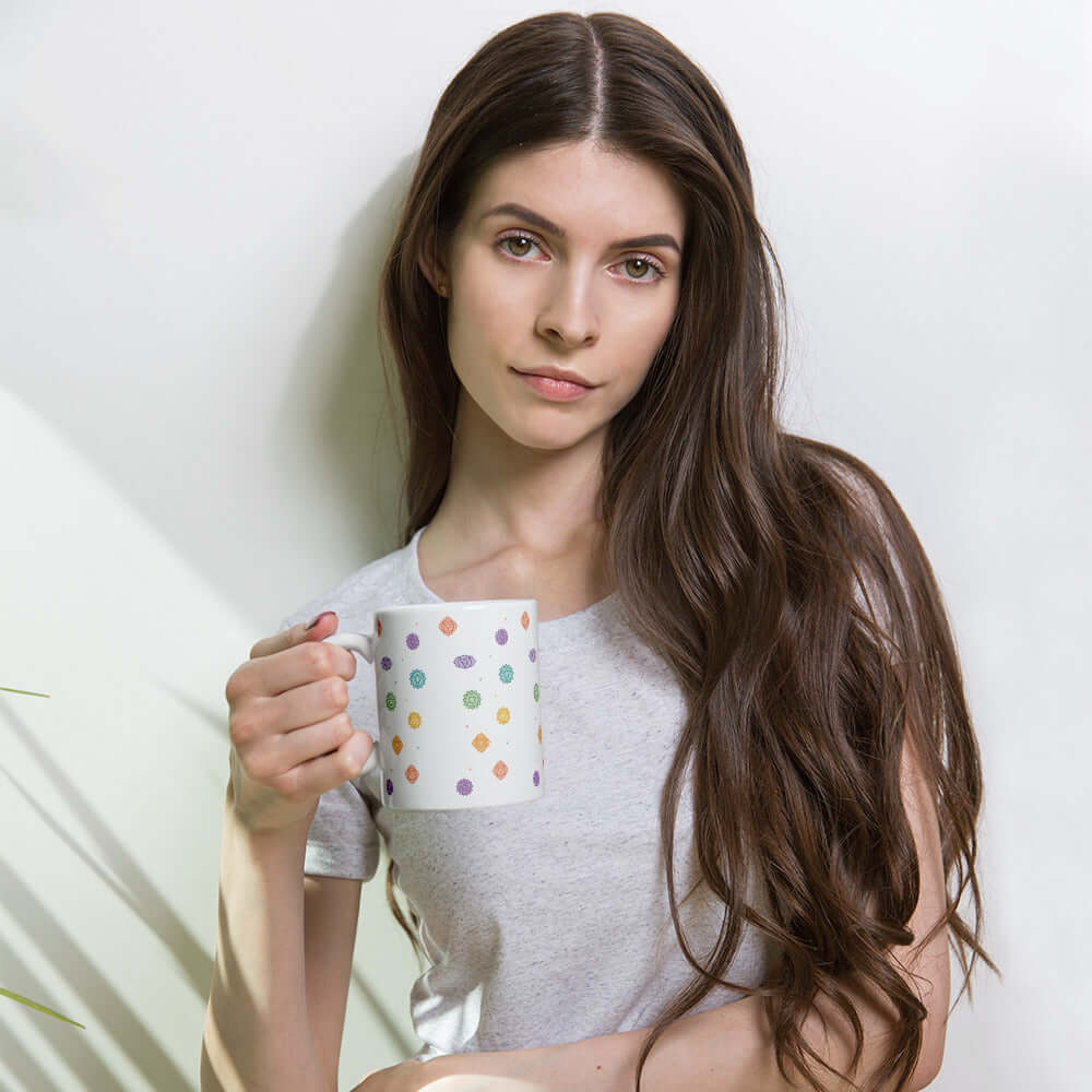 Chakra Balance Mug held by a woman with long hair, surrounded by soft light for a calming effect.